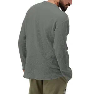 Detail view of men's casual grey seersucker long-sleeved shirt showing fabric texture