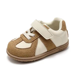 Stylish cream and brown toddler soft sole walking sneakers featuring a Velcro strap
