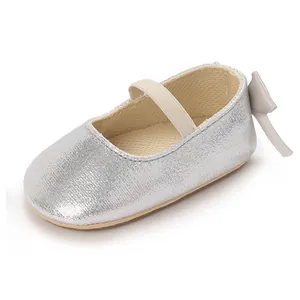 Detail view of silver glitter baby Mary Jane shoe featuring soft anti-slip sole and bow