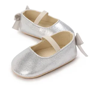 Silver metallic baby Mary Jane shoes with elastic strap and decorative heel bow detail