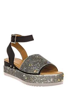 Close-up of sparkling rhinestone details on women's platform wedge sandals with ankle strap.