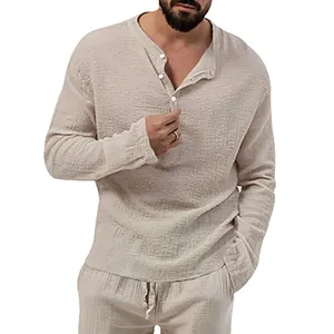 Close-up detail of men's beige seersucker shirt featuring a textured button-up design