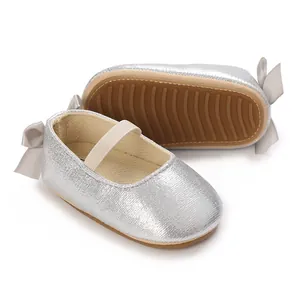 Detail view of silver metallic baby Mary Jane shoes with anti-slip soft silicone soles.