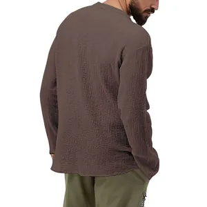Rear view of a men's casual brown bubble fabric long sleeve shirt showing texture detail