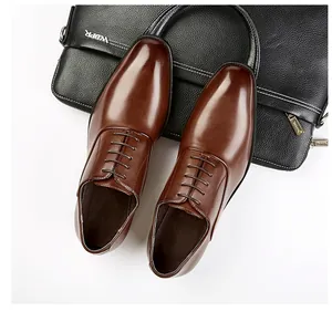 Detailed top-down view of premium brown leather business oxford shoes on a textured case