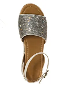 Detailed top view of a sparkling silver rhinestone sandal with ankle strap