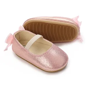 Detailed view of pink glittery baby Mary Jane shoes with non-slip soft silicone soles.