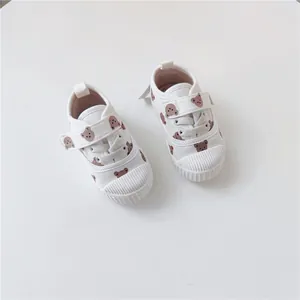 Cute white canvas toddler shoes featuring brown bear print and convenient velcro strap