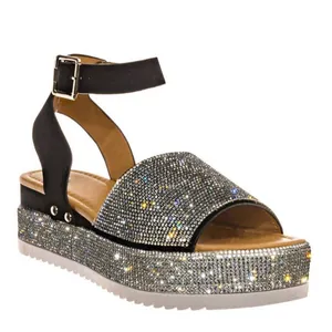 Sparkly rhinestone platform wedge sandals with adjustable ankle strap and sawtooth sole.