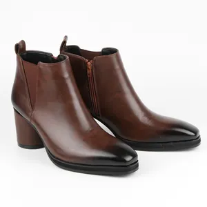 Angled side view of brown Chelsea boots with burnished toe and high chunky block heel