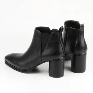 Detailed side view of black high heel Chelsea boots with chunky heel and elastic side