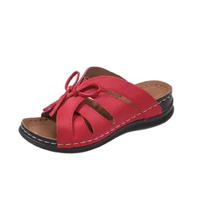 Comfortable red wedge slippers for women with elegant bow design and hollow details