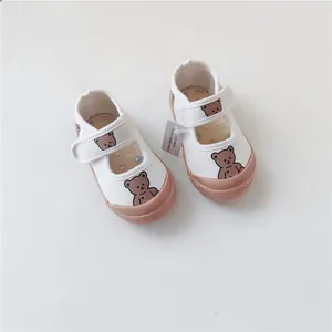 Comfortable white toddler canvas shoes featuring a cute cartoon bear and soft rubber sole