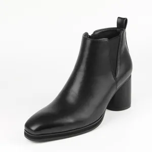 Sleek black high-heeled Chelsea boots with elastic side panels and chunky block heel.
