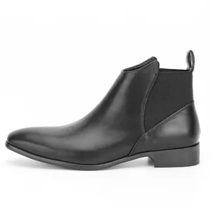 Side view of classic black leather Chelsea boot with elastic side panel and pull tab