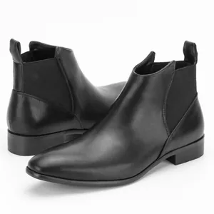Detailed side view of classic vintage black leather Chelsea boots for men in large sizes