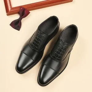 Chaussures richelieu classiques en cuir noir à bout rapporté pour homme d'affaires