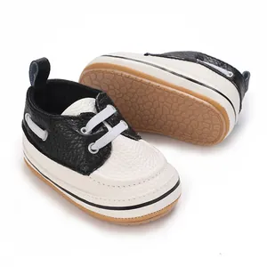 Classic black and white baby walking shoes with anti-slip soft soles