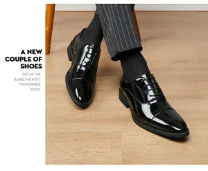 Polished black patent leather men's oxford shoes with elegant pointed toe design
