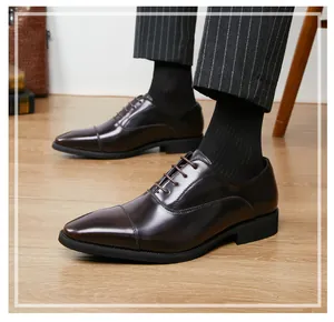 Close-up of polished dark brown cap-toe Oxford shoes for formal business attire