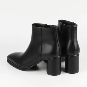 Detailed back view of black matte leather chunky heel ankle boots with side zipper