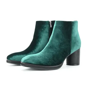 Elegant dark green velvet ankle boots featuring a chunky mid-heel and side zipper