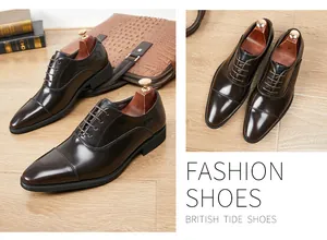 Detailed view of polished brown leather cap-toe Oxford shoes with fashion typography.