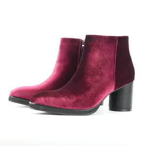 Side view of elegant men's burgundy velvet ankle boots featuring a block heel and zipper