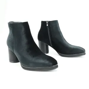 Elegant black velvet ankle boots with a chunky block heel and side zipper detail