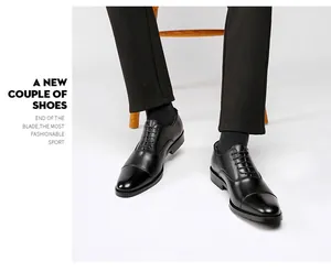 Detailed view of men's black leather oxford shoes featuring a classic cap toe design