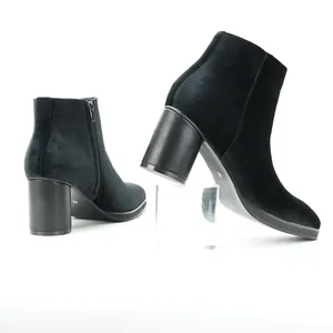 Close-up of black velvet men's Chelsea boots with chunky heel and side zipper