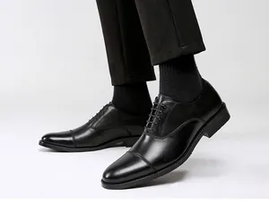 Close-up of elegant black leather Oxford shoes for men in a formal business style