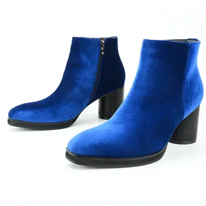 Detailed side view of blue velvet men's Chelsea boots featuring a black block heel