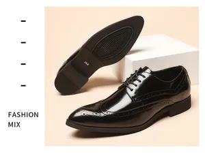 Men's shiny black patent leather brogue shoes showing wingtip detail and sole