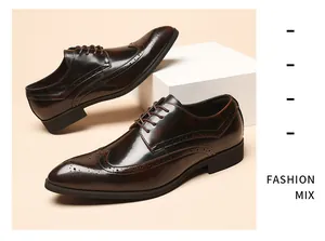 Classic men's brown wingtip brogue shoes with decorative perforations in a shiny finish