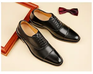 Elegant men's black leather cap-toe Oxford shoes designed for formal business attire