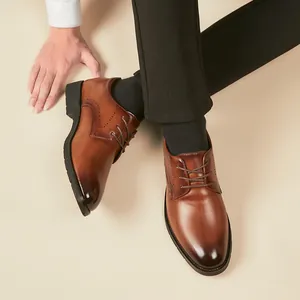 Classic men's brown leather Oxford shoes with elegant brogue details for business formal wear