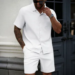 Full view of white men's short sleeve shirt and matching shorts set on model