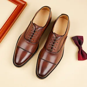 Classic brown genuine leather oxford shoes for men's business and formal attire.