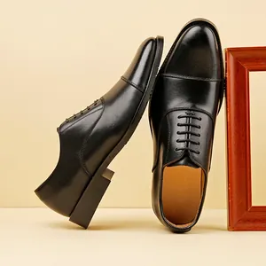 Handcrafted men's classic black leather Oxford dress shoes with formal cap-toe design