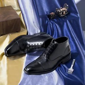 Elegant men's black leather business dress boots featuring a sleek lace-up design.