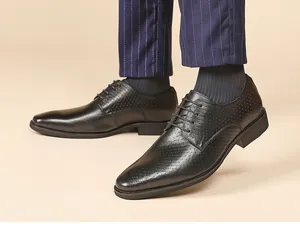 Close-up detail of men's black embossed leather derby shoes for business formal wear