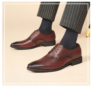 Detailed view of brown embossed leather derby shoes for men in business formal style