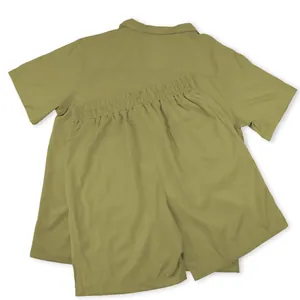 Back view detail of olive green men's casual shirt and elastic waist shorts set