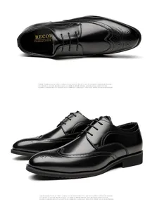 Detail of black brogue dress shoes with classic wingtip decorative perforations.