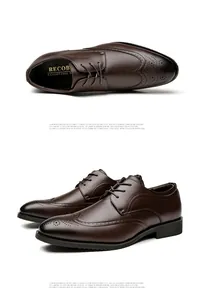 Detailed view of professional brown leather wingtip brogue dress shoes with elegant carvings