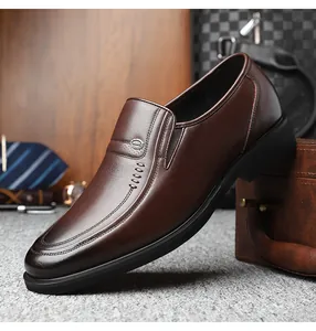 Detail shot of premium brown leather men's business dress shoes with slip-on design.