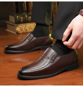 Premium brown leather slip-on dress shoes for men shown in a business lifestyle setting