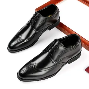 Classic black men's brogue dress shoes with intricate carved details and pointed toe