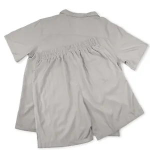 Back view of a casual grey two-piece set featuring a short-sleeve shirt and pocketed shorts